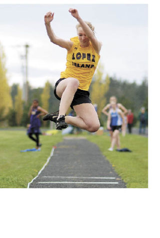 Lyra Dalton competing in the long jump at Lopez School on April 15. She came fourth with a jump of  13 feet  6 inches.  The team competed against five other schools