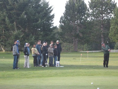 PGA Pro Steve Nightingale giving the 2012 high school team a chipping lesson.