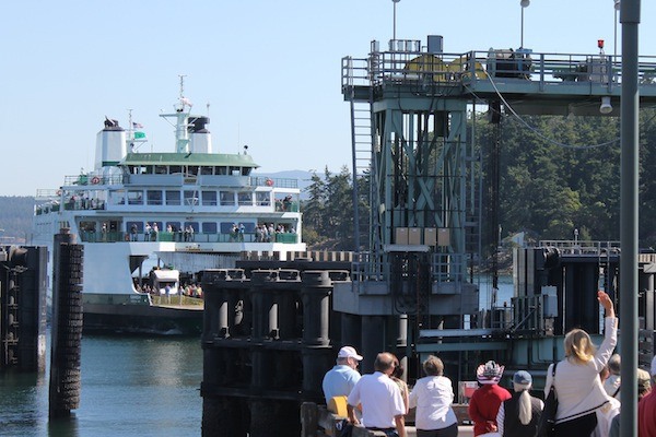 WSDOT CEO Lynn Petersen waves a welcome to the new Samish on its maiden voyage to Friday Harbor