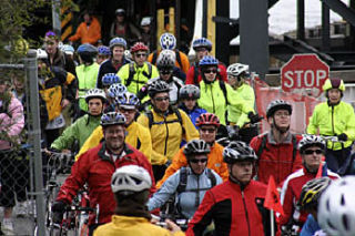 The Tour kicks off as the ferry unloads hundreds of cyclists.