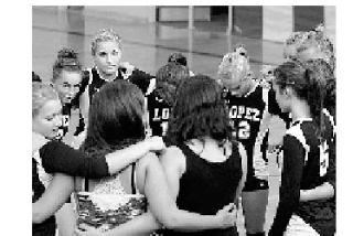 Clockwise: The team takes a moment to focus before the Lopez-North Sound game