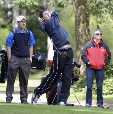 Chase Schober drives off the 6th tee at the Lopez Course while a La Conner golfer and parents watch.