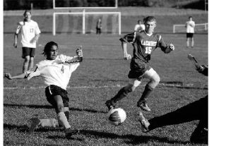 Gene Helfman photo Nia Bartolucci scores on La Conner’s goalkeeper with less than a minute left to play.  Lopez beat La Conner on Oct 16