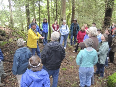 Boyd Pratt giving a talk on a hike