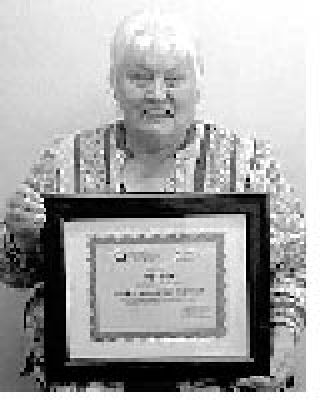 Joy Davis and her award.