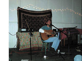 Above: vocalist Danny Schmidt and his acoustic guitar. Right: Signage on a summer day for sizzling sounds