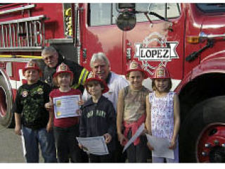 Fire prevention poster contest winners get a fire engine ride