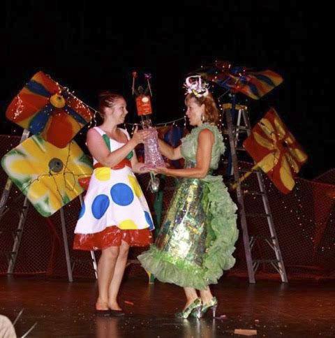 Mary Grace Lartz accepting award for her Trashion ball gown made of recycled aluminum cans and grocery bags.