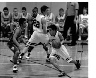 Left  photo: Tak Peralta (5) drives to the basket against Marysville Getchell in the Lobos’ 53-47 win against the Chargers on Dec. 14.