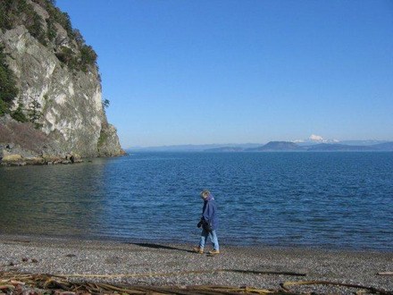 Peggy Martin walks on the shores at  Watmough Bight on Lopez Island.
