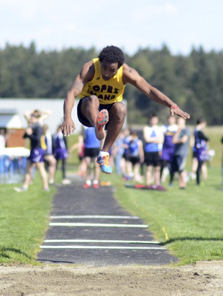 Senior Solomon Bill gets off a qualifying effort in the long jump at the Lopez track meet on April 16.  Bill won the two mile run and also competed in the 100 meter dash and 4x100 meter boys relay.