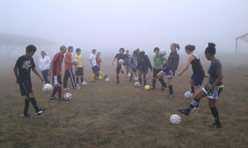 The Lopez Island Lobos soccer team practices their skills on a foggy day.