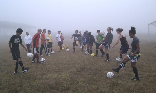 The Lopez Island Lobos soccer team practices their skills on a foggy day.