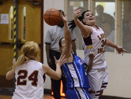 Marina Steinbrueck (#12) and Alexa Ogden (#24) fight for a rebound against Grace Academy. Steinbrueck was recently selected for second team for the 2011-12  Northwest 'B' All League Teams.