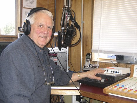 Ron Metcalf of The Ron and Steve Show presses the magic button to take a call at KLOI’s Center Road studio.