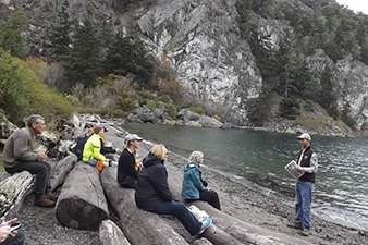 An interpretive talk at Watmough Bay