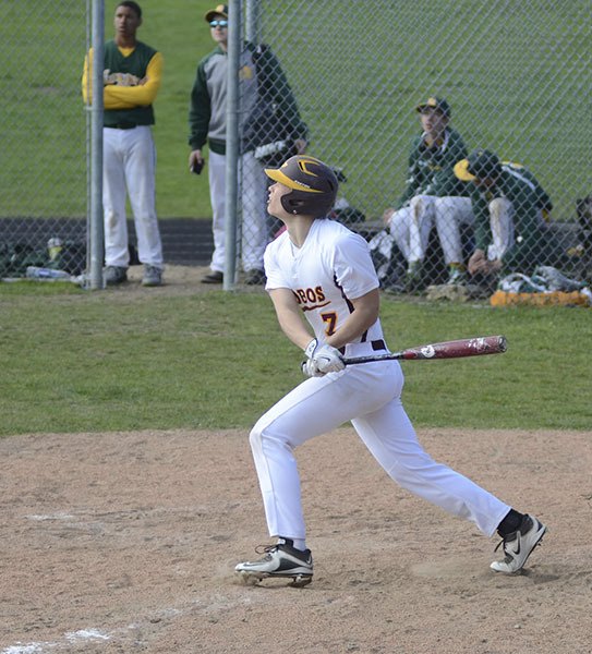 Finnish exchange student Toni Ahonen follows the flight of the ball in the April 29 game versus Darrington. Ahonen led the Lobos in hitting in an 11-9 loss.