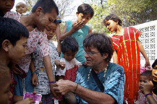 Jim Rohrssen with children in the Bagan region of Burma in a happier time.