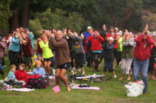 Participants join in the “jelly fish dance” before the 10th Annual Steve Braun Memorial Triathlon.