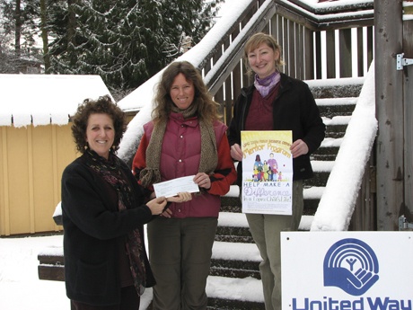 Danah Feldman delivering a check to Susie Teague and Contessa Downey of the Lopez Family Resource Center.