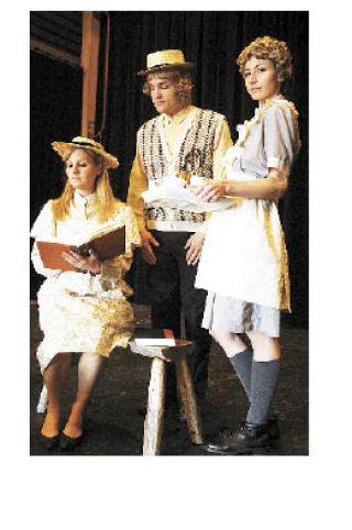 Photo above: rehearsing in costume are (left to right): Joy Goldberg