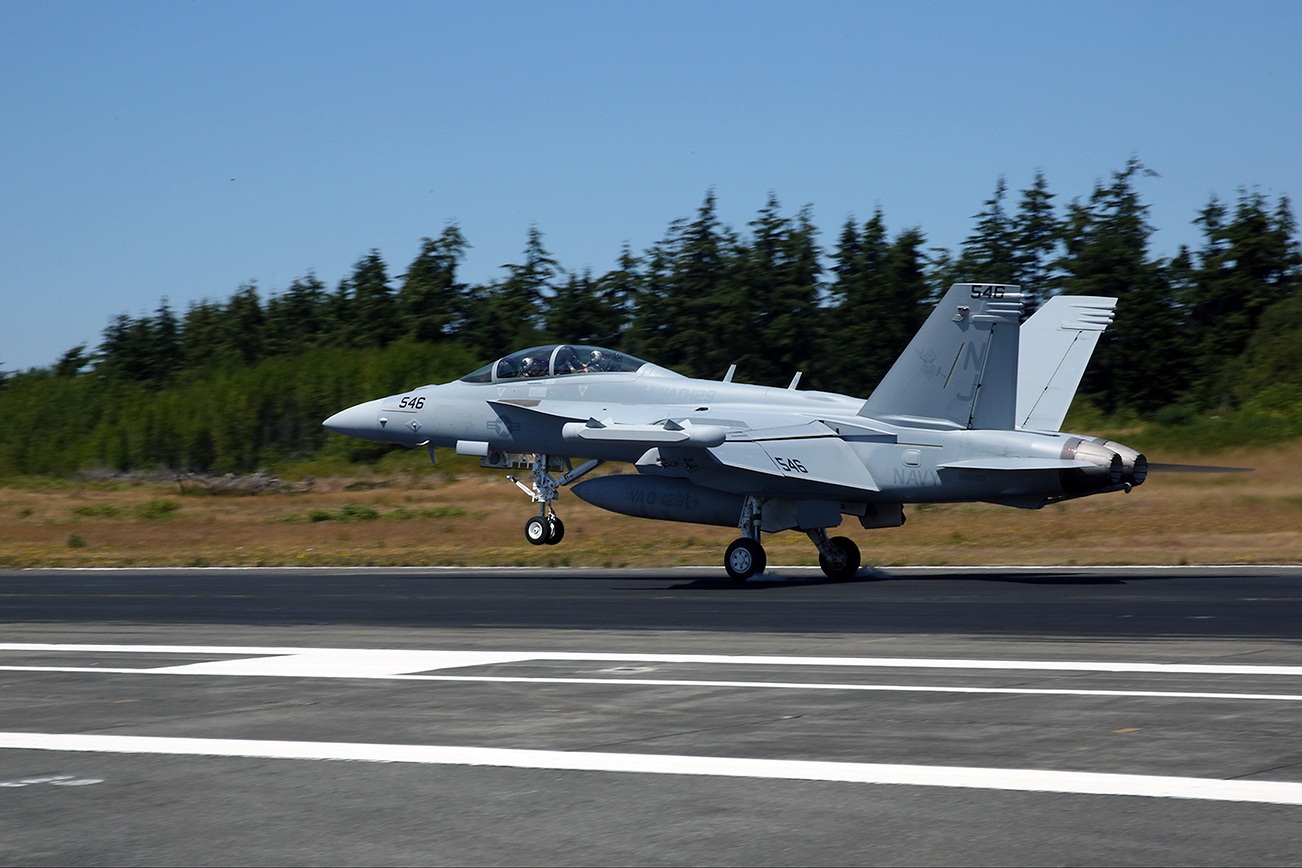 An EA-18G Growler assigned to Electronic Attack Squadron (VAQ) 129 lands on Naval Air Station Whidbey Island’s Ault Field. VAQ-129 is the U.S. Navy’s fleet replenishment squadron for EA-6B Prowlers and EA-18G Growlers. (U.S. Navy photo by Mass Communication Specialist 2nd Class John Hetherington/Released)