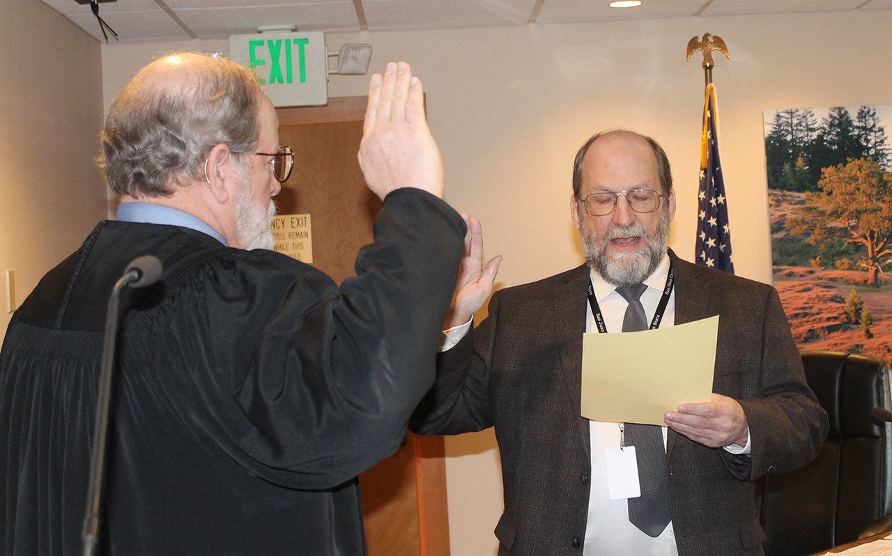 Staff photo/Hayley Day                                Bill Watson, District 1, is sworn into San Juan County Council on Jan. 10.