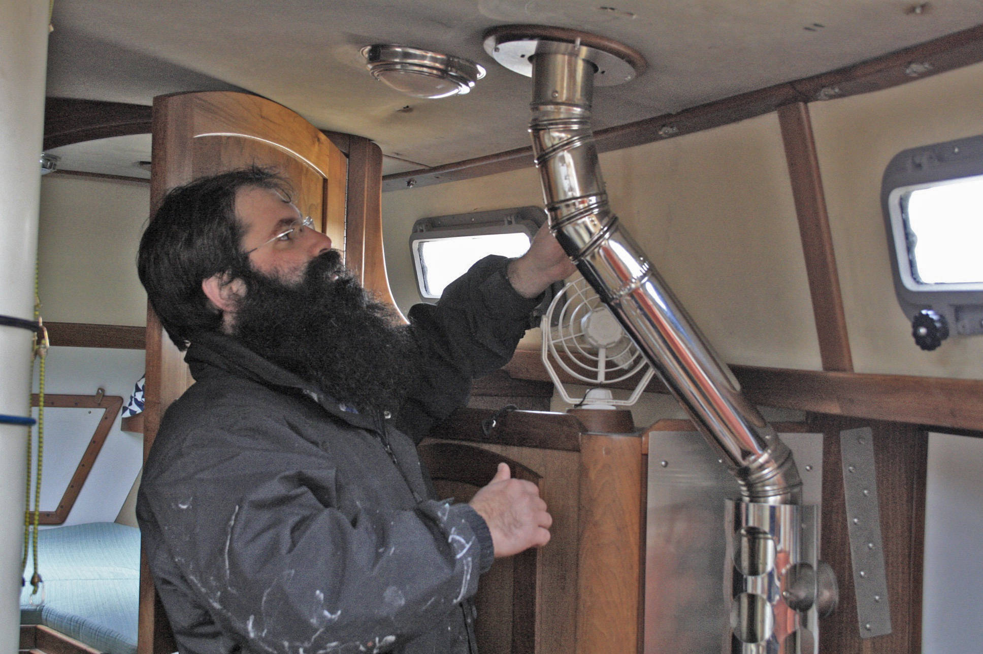 Staff photo/Hayley Day                                Nate Hertel is rebedding a boat deck at Albert Jensen and Sons Boat Yard and Marina on San Juan Island.