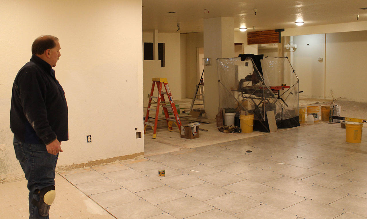 Staff photo/Hayley Day                                A worker stands in the hostel’s kitchen during construction.