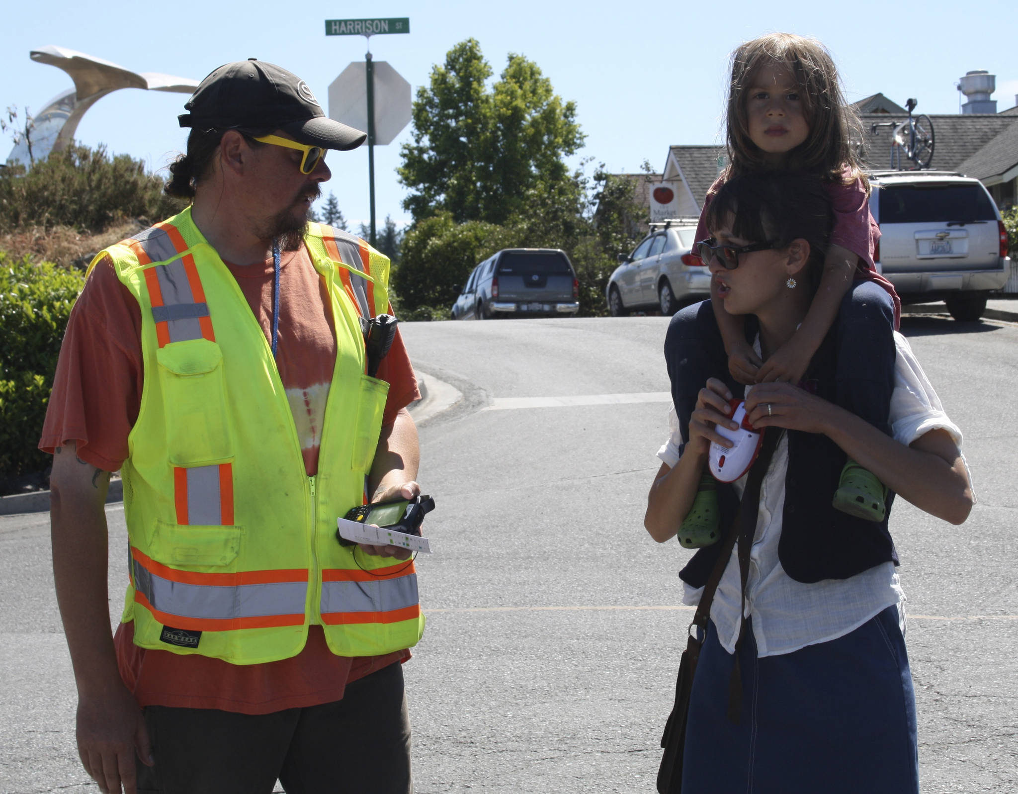 Staff photo/Hayley Day                                Washington State Ferry employee Robert Kyte answers questions about delays at the Friday Harbor terminal on Tuesday, July 18.