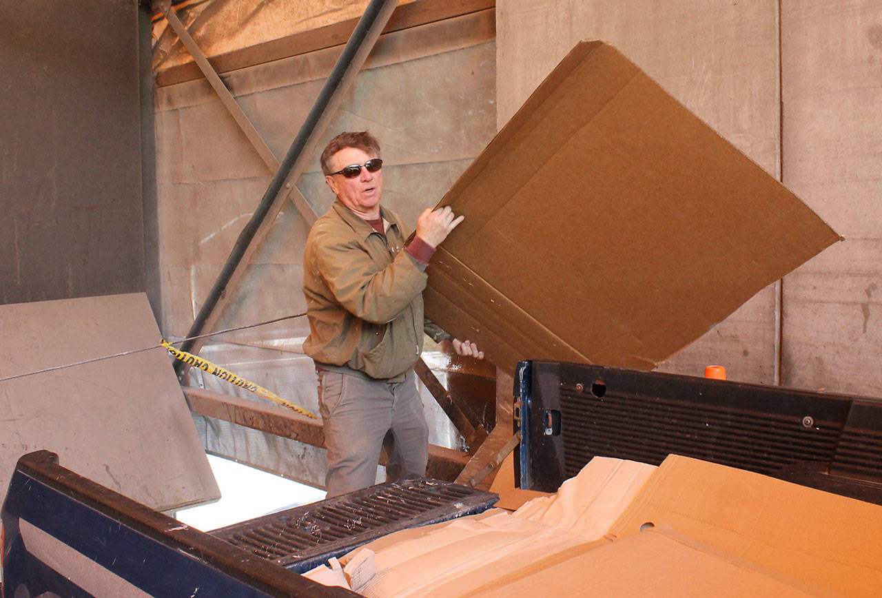 Staff photo/Hayley Day                                An islander recycles materials at the San Juan Island Transfer Station.