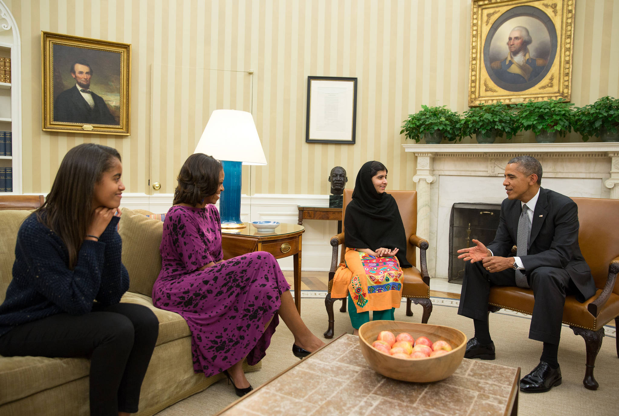 Pete Souza, official White House photo.                                President Barack Obama, First Lady Michelle Obama, and their daughter Malia meet with Malala Yousafzai, the young Pakistani schoolgirl who was shot in the head by the Taliban, in the Oval Office, Oct. 11, 2013.