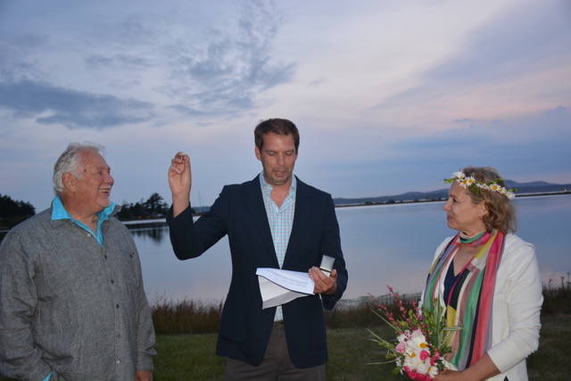 Contributed photos                                 Ross and Rebecca MacDonald married on July 4 with officiant Dave Sather (center).
