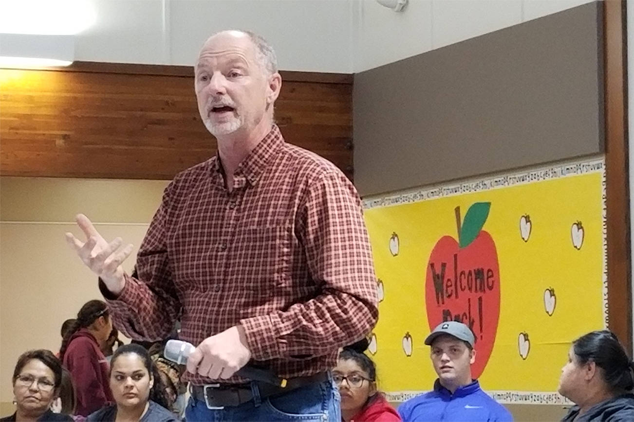 Lopez Island School District Board Chairman John Helding speaks to a room full of Lopezians at the Sept. 25 school board meeting. <em>(Mandi Johnson/staff photo)</em>