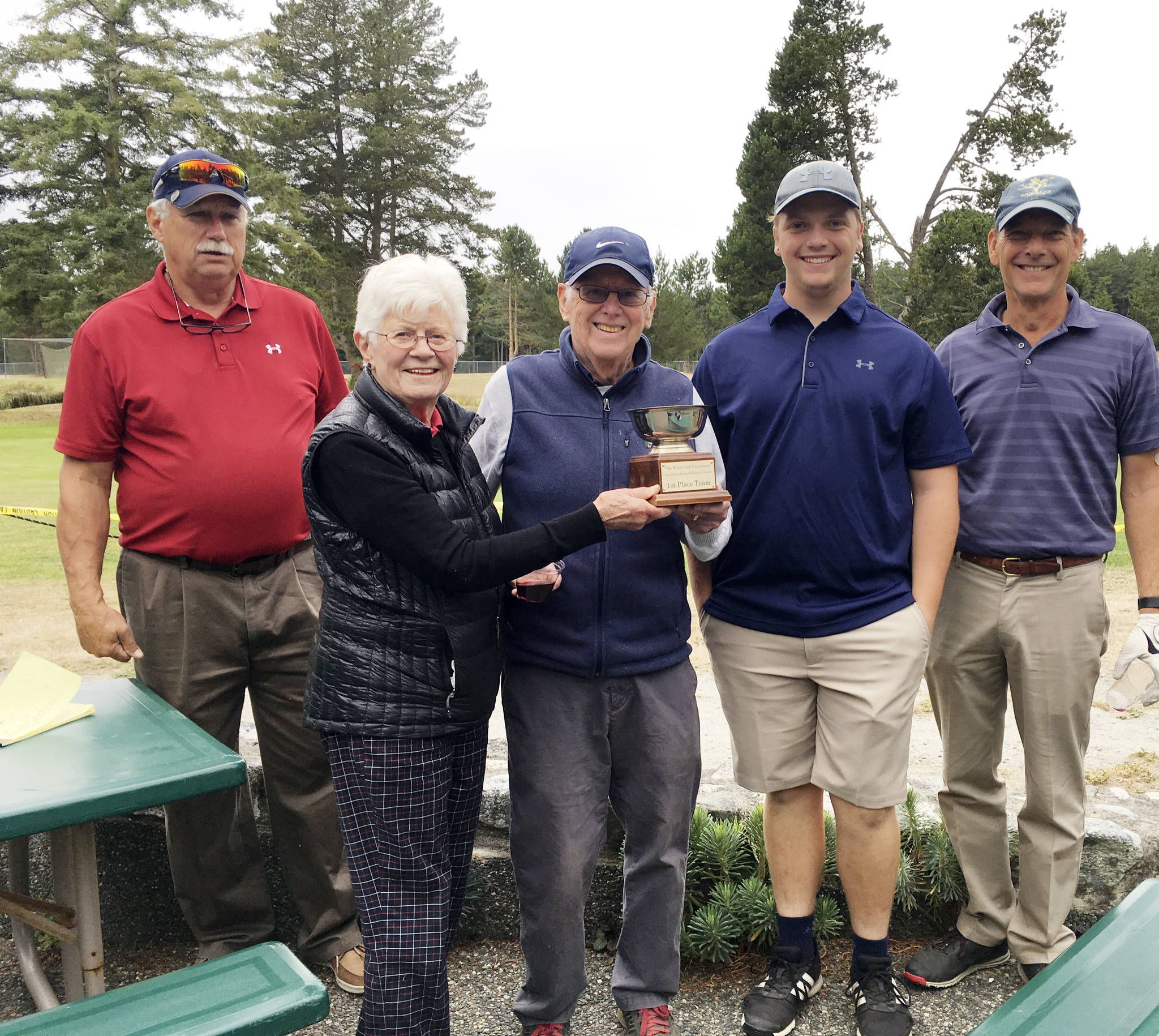 Contributed photo                                Jim Ghiglione, tournament manager, presents the Wurst First Place trophy to Barbara Reiswig, Dick Reiswig, Reese Hamilton and Captain Eric Meng.