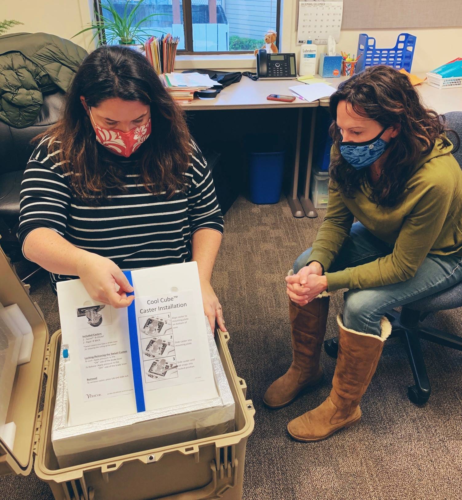 San Juan County Health and Community Services Department staff opening the first shipment of COVID vaccine to arrive in the islands. (Contributed photo)