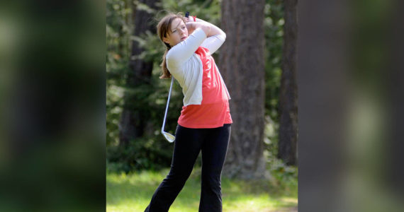 Contributed photo
Sarah Reeve hits a long iron on the ninth hole at Lopez in a match against Friday Harbor in April 2012.