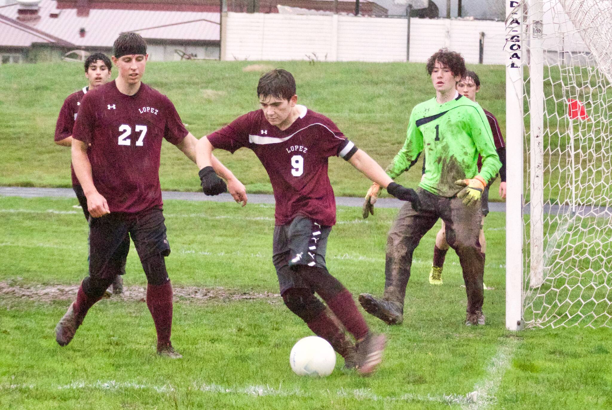 Contributed photo
Ananda Velo (9) clears the ball from in front of the Lopez goal as Josh Kramer (27) and keeper Levi McClerren (1) help defend against Mt. Vernon.