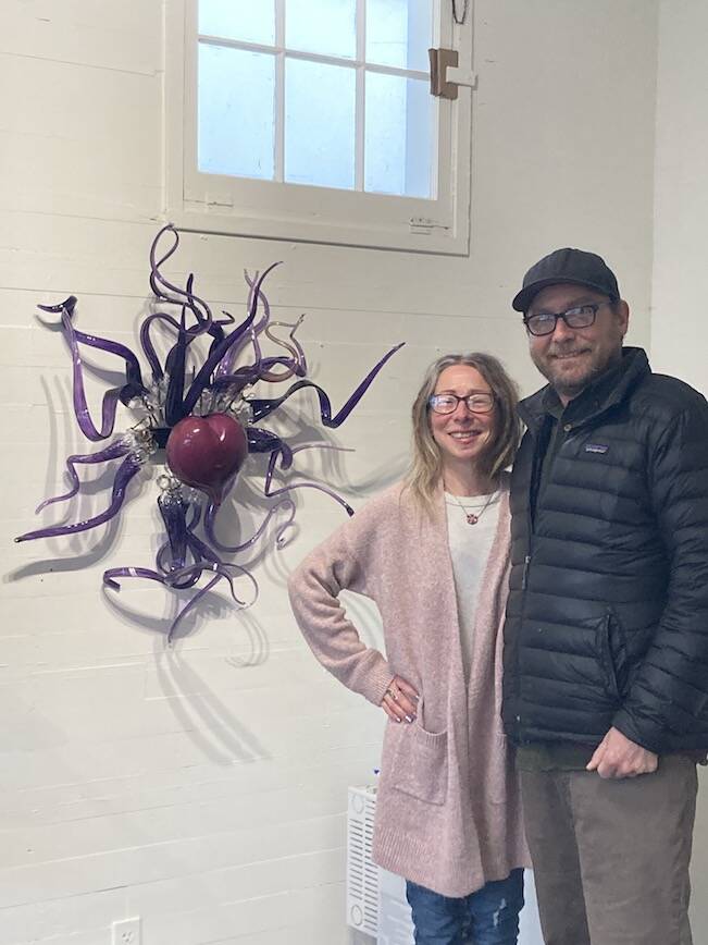 Staff photo/ Sienna Boucher.
Jennifer Anderson (left) and Rahman Anderson (right) posing in front of a glass heart in their gallery.