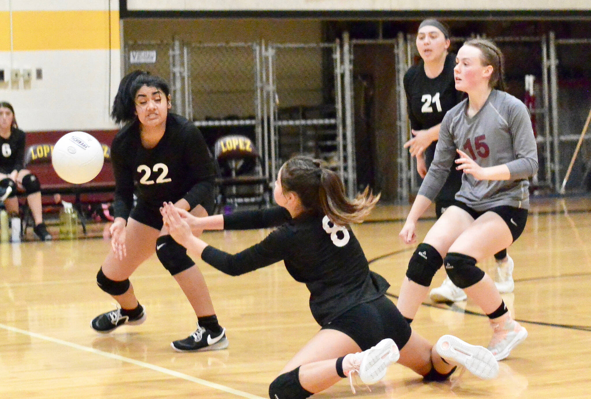 Gene Helfman/Contributed photo
Seniors Valentina Rendon (22), Jamie Armstrong (8), and Lolo Meissner (15) converge on a ball that found a gap while Amelia Patino (21) watches. Lopez swept Shoreline Christian 3-0 in the Sept. 30th match.