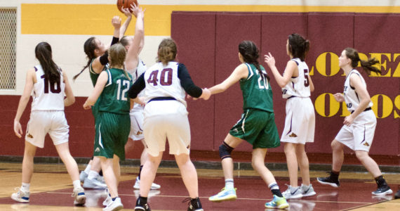 Contributed photo by Gene Helfman
Dani Arnott brings down a rebound against Cedar Park as (left to right) Glory Westervelt (10), Betty Burt (40), Josie Luckhurst-Slattery (5), and Ruby Ervin-McLean help in defense. Lopez defeated the Lions 33-17, for their third victory of the year.