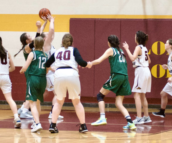 Contributed photo by Gene Helfman
Dani Arnott brings down a rebound against Cedar Park as (left to right) Glory Westervelt (10), Betty Burt (40), Josie Luckhurst-Slattery (5), and Ruby Ervin-McLean help in defense. Lopez defeated the Lions 33-17, for their third victory of the year.