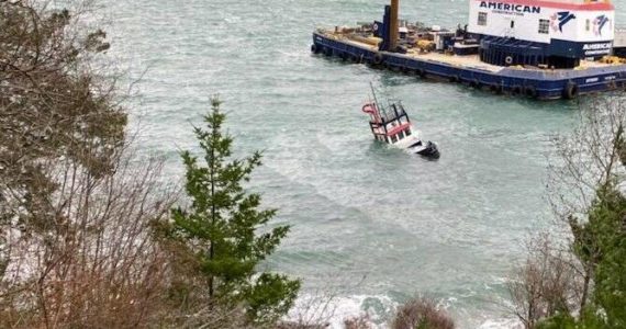 Contributed photo.
A 45’ tug boat carrying approximately 400 gallons of diesel fuel partially sank off the Lopez ferry terminal Wednesday morning.