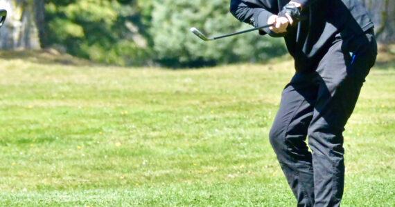 Contributed photo
Senior golfer Deston Dupuis pitches onto the eighth green at the Lopez golf course during the match with Mount Vernon Christian, April 27th.