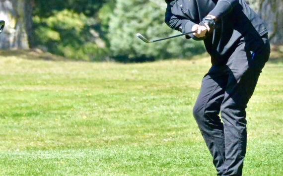 Contributed photo
Senior golfer Deston Dupuis pitches onto the eighth green at the Lopez golf course during the match with Mount Vernon Christian, April 27th.
