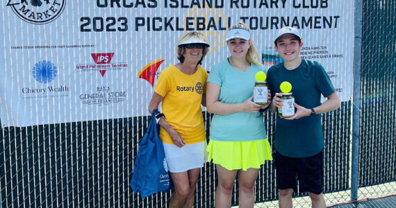 Tournament director Linda Hamilton with Group B Mixed Doubles second-place winners Monica
Connell and Ethan Brazil/Contributed photo