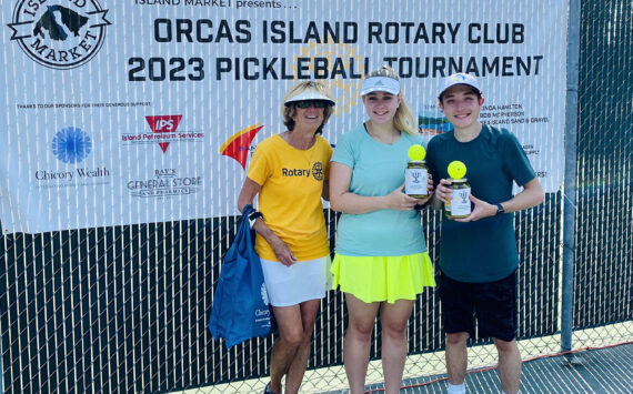 Tournament director Linda Hamilton with Group B Mixed Doubles second-place winners Monica
Connell and Ethan Brazil/Contributed photo