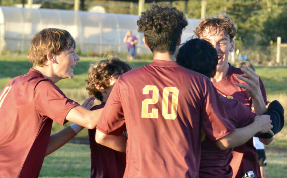 Contributed photo by Gene Helfman
Jubilant Lobos (left to right) Andris Meisner (#11), Juan Pelligrino, Henry Robles (20), and Ethan Patrick mob Jacob Velazquez-Velazco after his third and clinching goal of the match against Coupeville Oct 17.