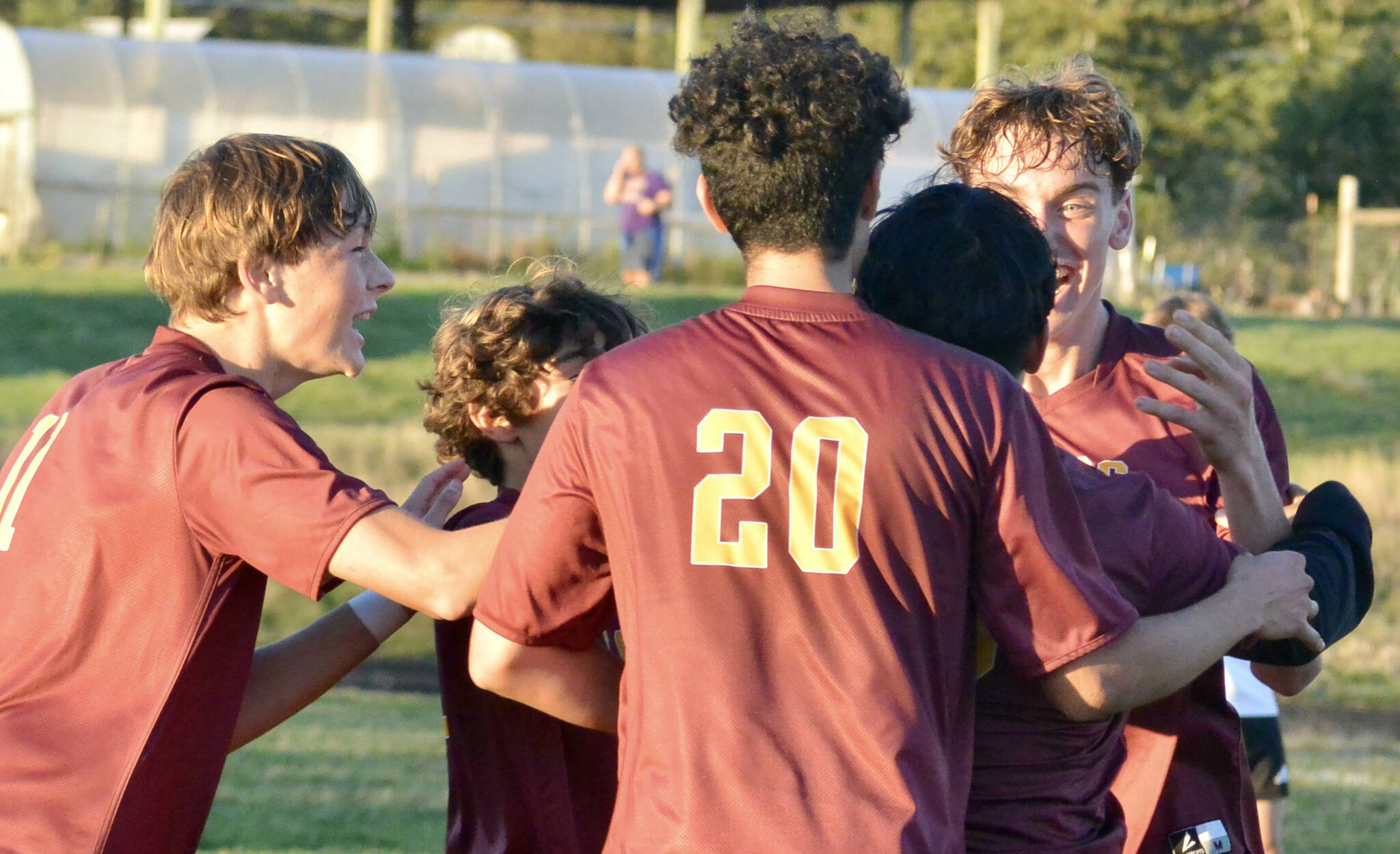 Contributed photo by Gene Helfman
Jubilant Lobos (left to right) Andris Meisner (#11), Juan Pelligrino, Henry Robles (20), and Ethan Patrick mob Jacob Velazquez-Velazco after his third and clinching goal of the match against Coupeville Oct 17.