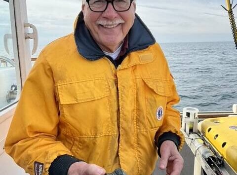 Adam Summers photo
Dr. H. Gary Greene holds a sample of vesicular basalt at the site of the Devil’s Mountain Volcano